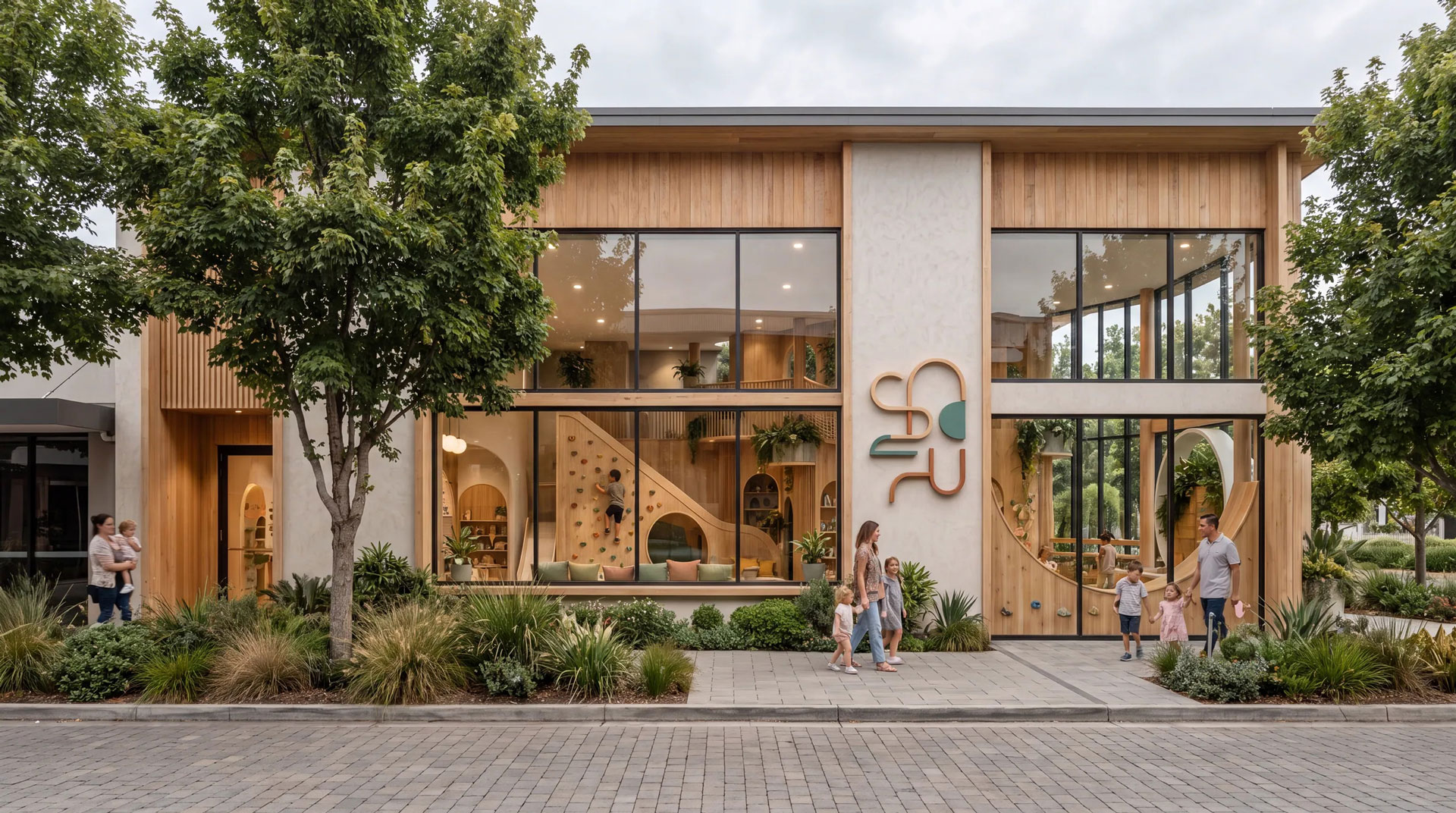 Contemporary childcare centre with warm wood cladding, expansive glazing, integrated play features, and landscaped public frontage
