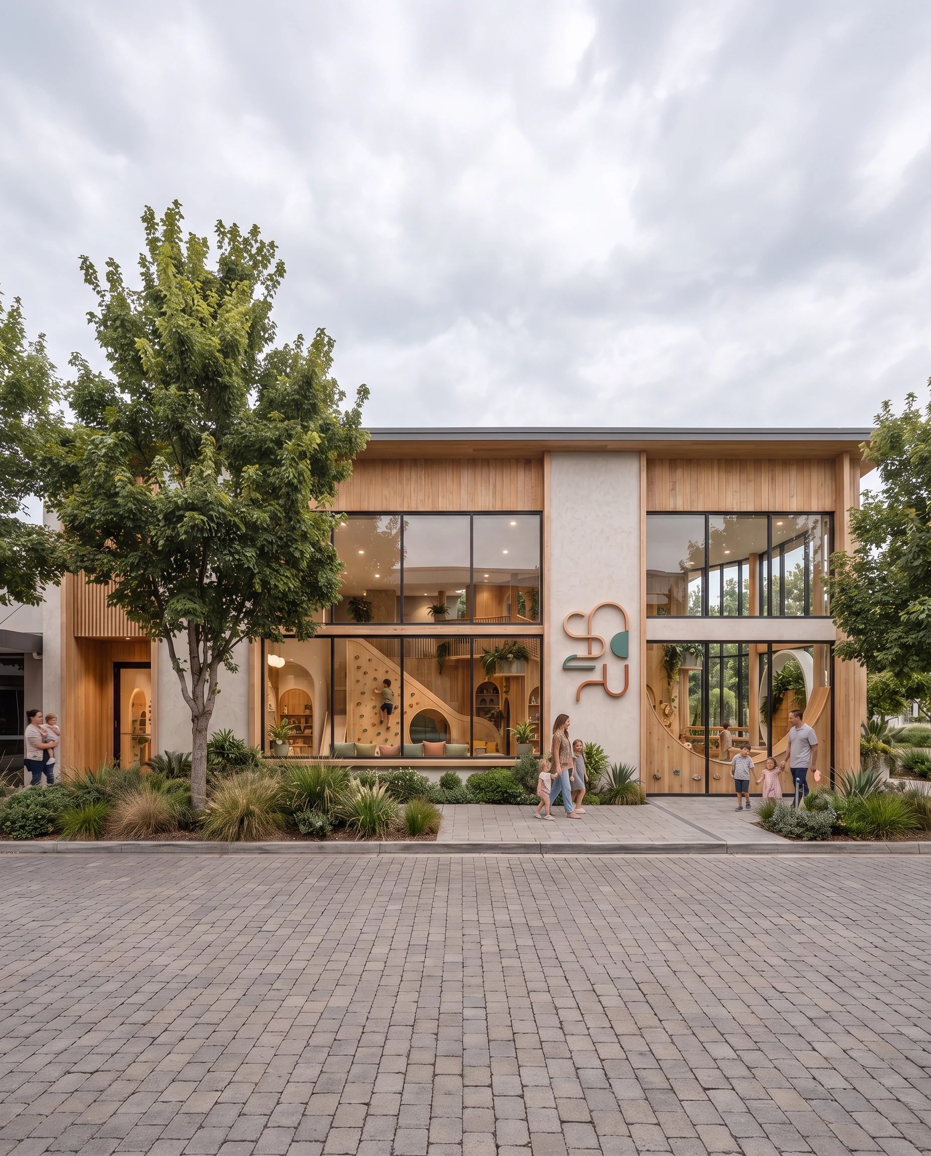 Contemporary childcare centre with warm wood cladding, expansive glazing, integrated play features, and landscaped public frontage
