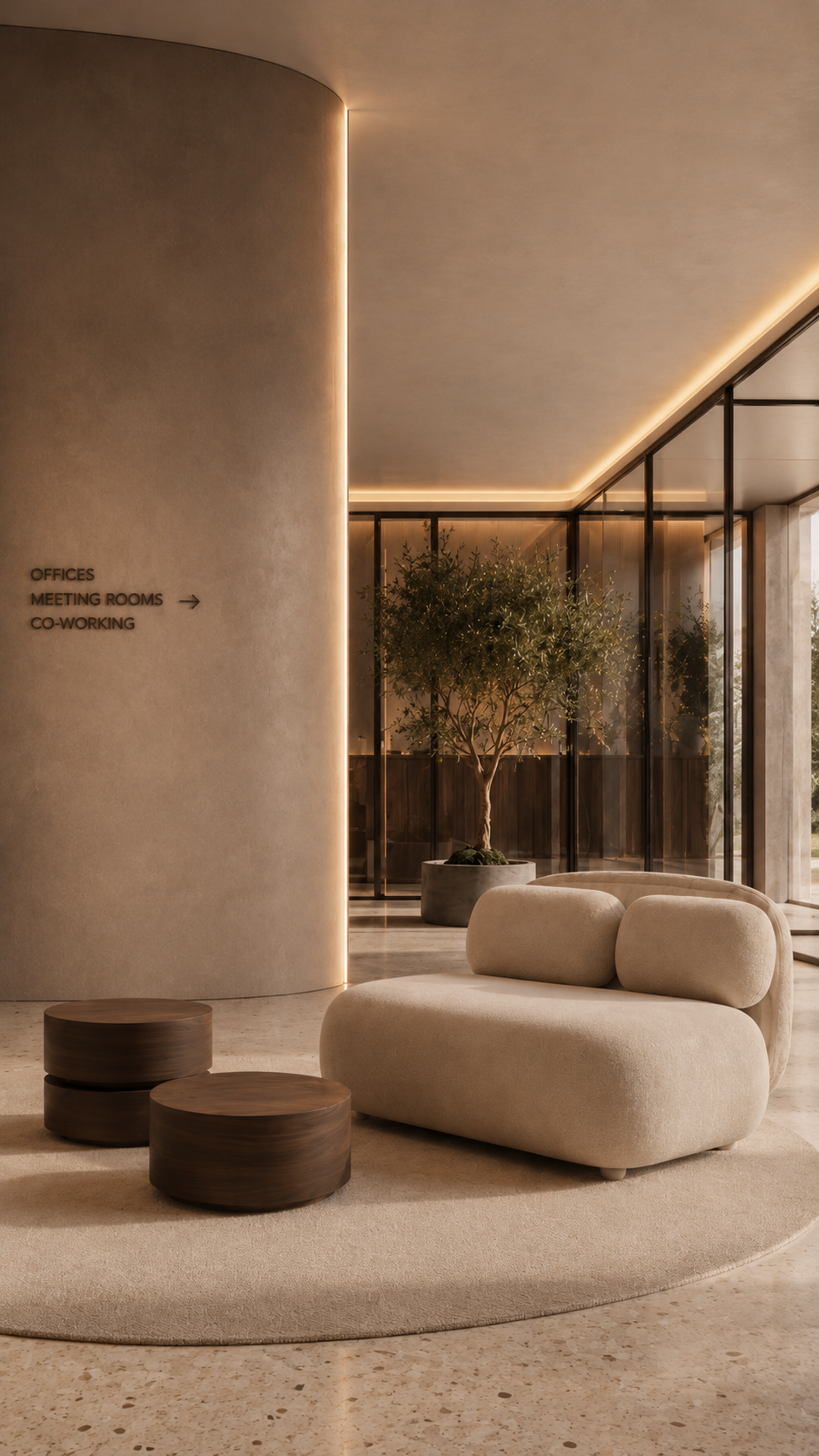 Workplace lobby with curved walls, integrated lighting, and lounge seating